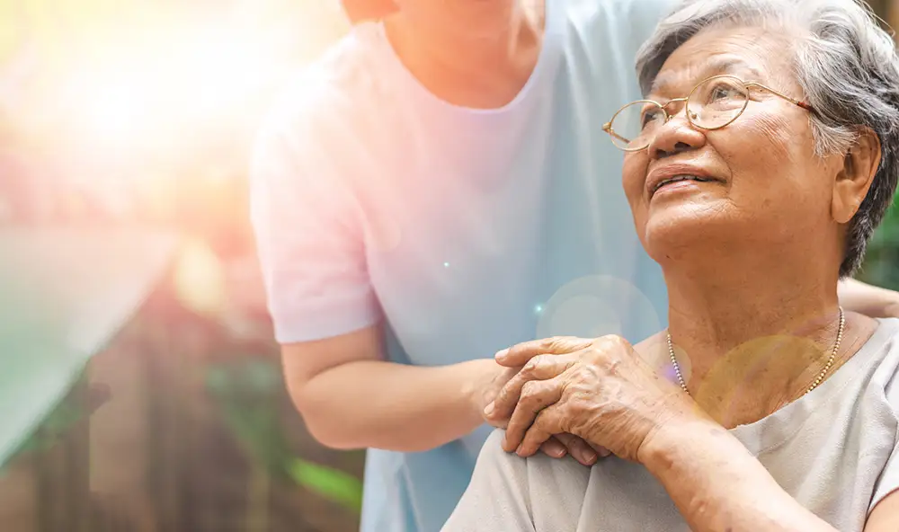 Caregiver, carer hand holding elder hand in hospice care. Philanthropy kindness to disabled concept.