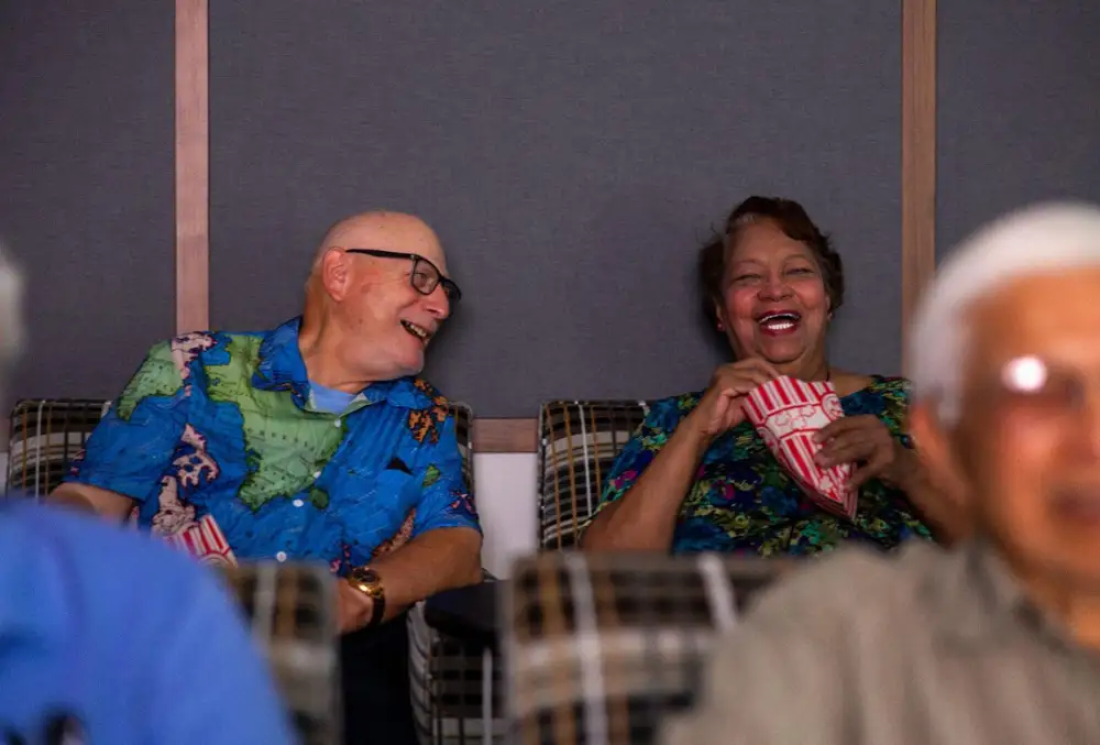 a group of seniors watching a movie 